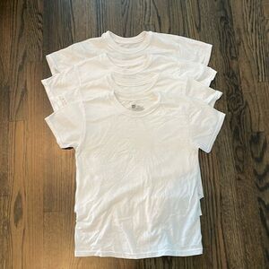 Four Hanes undershirts